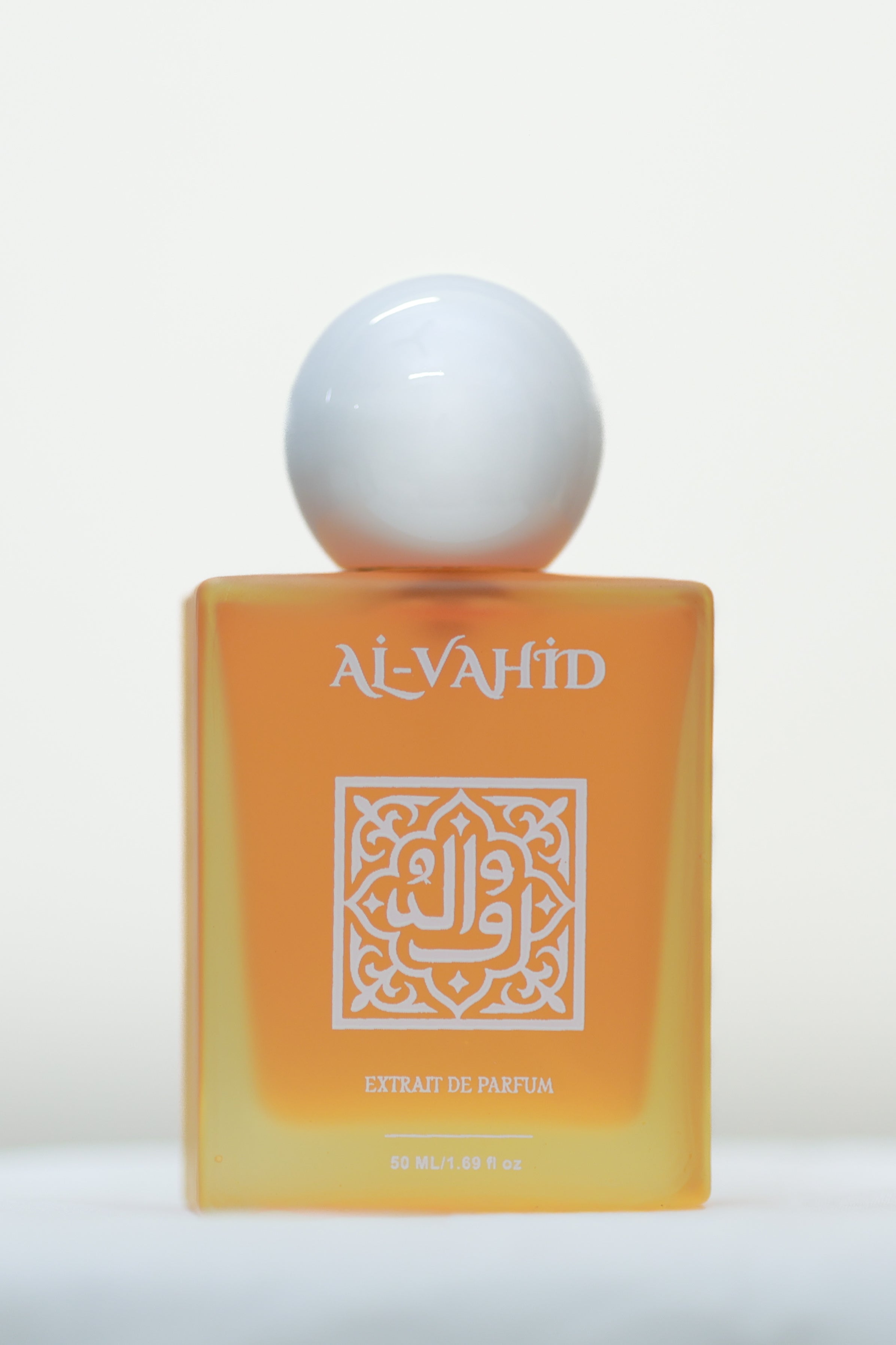 Yellow perfume bottle with a white cap on a white background